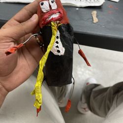 hotdog in a tux with mustard tie 