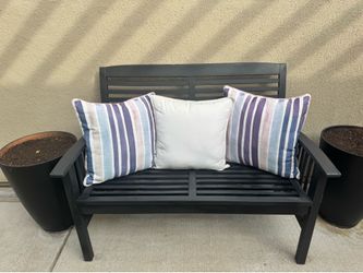 Entryway, wood bench, two chairs, and small table.