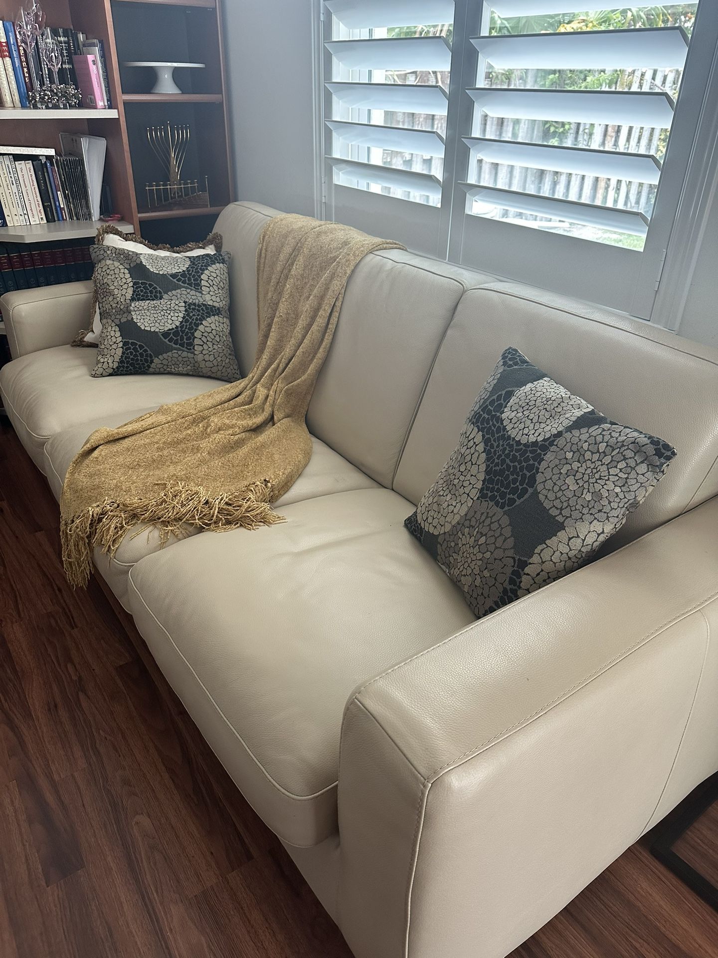 Natuzzi tan sofa with nice comfortable sleeper.