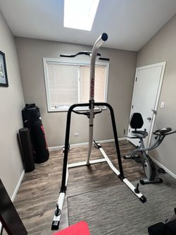 Fitness training station / pull up bar, dip, and punching bag