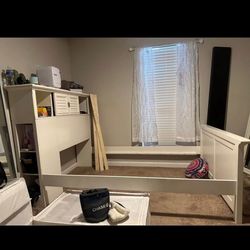 Full size bed frame with book storage and cabinets