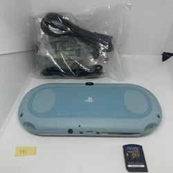 Ps vita 2000 light blue w/game & charger