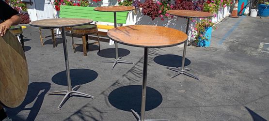 Cocktail tables, 30" bar stools, tablecloths, and umbrellas