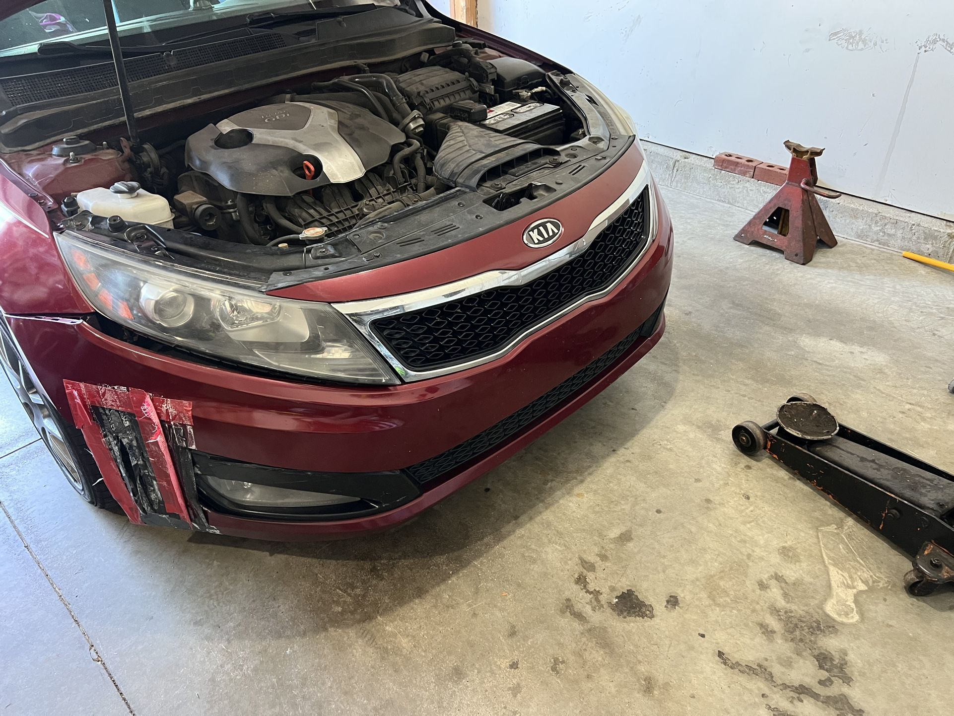 Red 2012 Kia Optima SX bumper