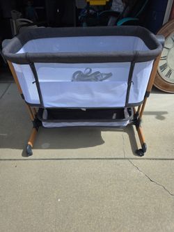 Bedside Bassinet with Mesh Sides and Wheels