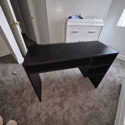 Dark desk with shelves