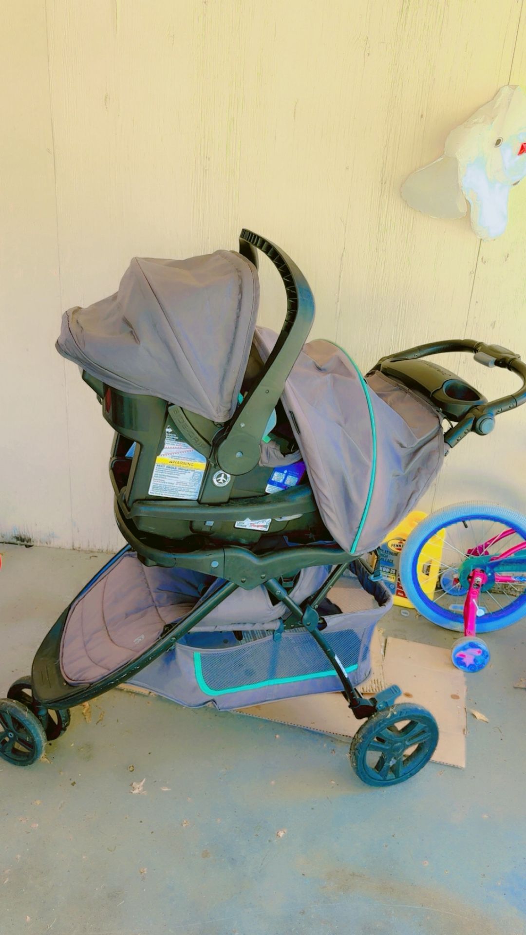 Stroller with baby carrier and base for sale