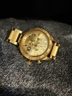Nixon, golden watch