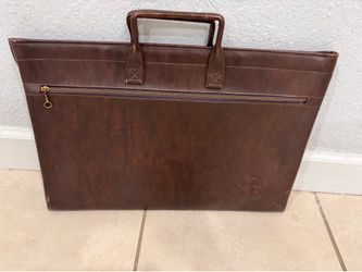 Two vintage leather portfolio carry cases (one features an embossed "GE" logo).good condition