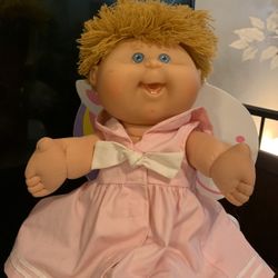 Cabbage  doll Press her belly buttom and she Laughs  moves her Arms and Legs.  