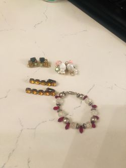 Vintage clip on earrings and sterling silver bracelet with crystals. Make me an offer