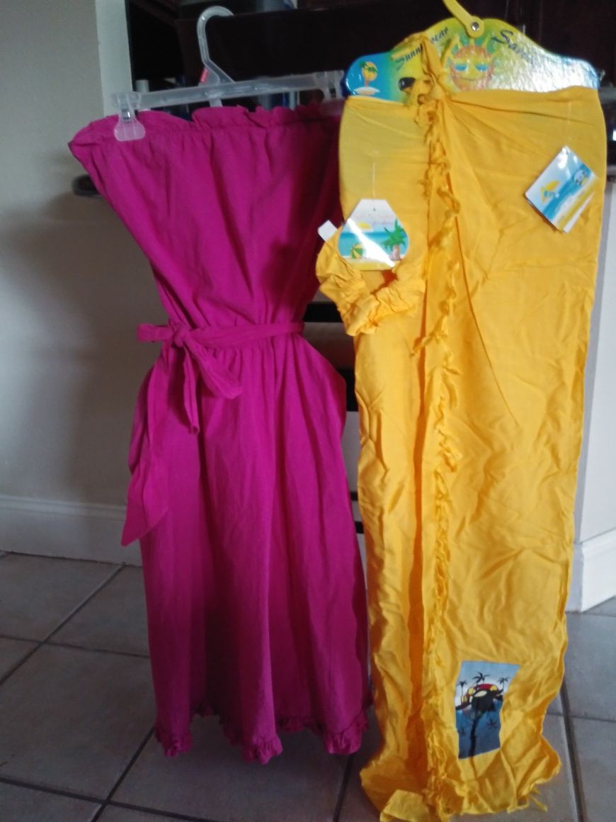 2 sweet dresses. Shoulderless. Pink with the and bottom ruffle. And. New yellow surong