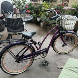 3 speed Electra beach cruiser, with basket, rack, helmet, lock, pump, bell and cover.