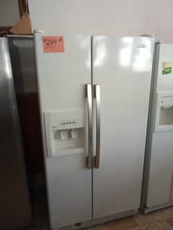 SALE Whirlpool side by side refrigerator white clean . Warranty . Delivery available . 2203 Fowler st. Ft. Myers 33901