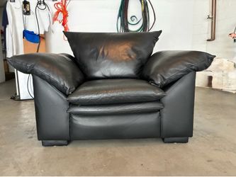 Oversized black leather chair