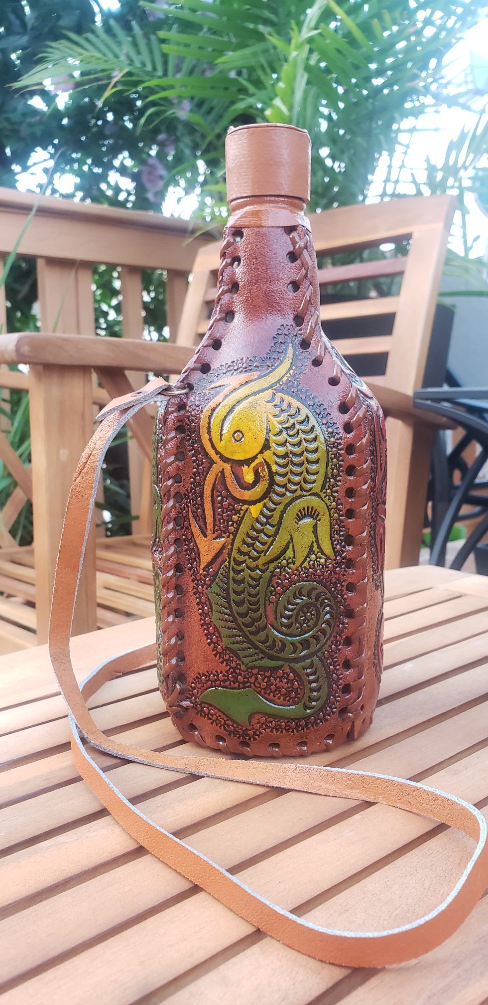 Glass bottle wrapped in leather