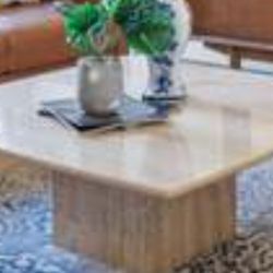 A vintage travertine coffee table 