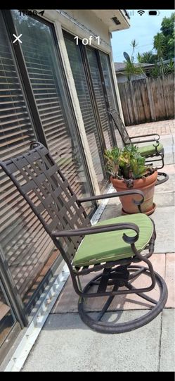 2 Outdoor swivel chairs with cushions