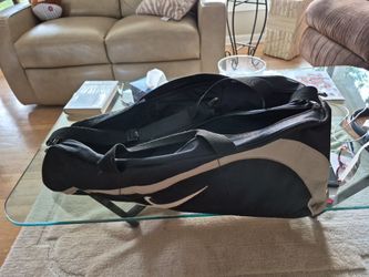 Niki double zip..tennis or racquet ball bag.shoulder  strap to help carrying.