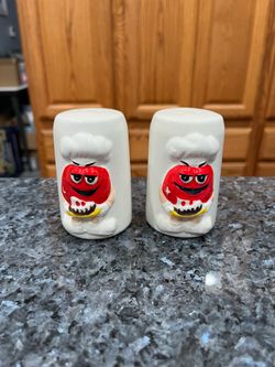 Ceramic M & M’s White with Red pair of salt and pepper shakers.  Preowned.  Has been on display in a cabinet with a very large salt and pepper shakers