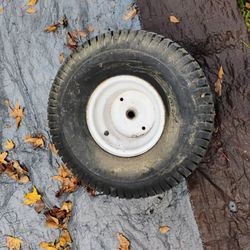 ALMOST NEW RIDING MOWER TIRE WITH RIM 