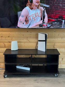 Black TV stand on wheels