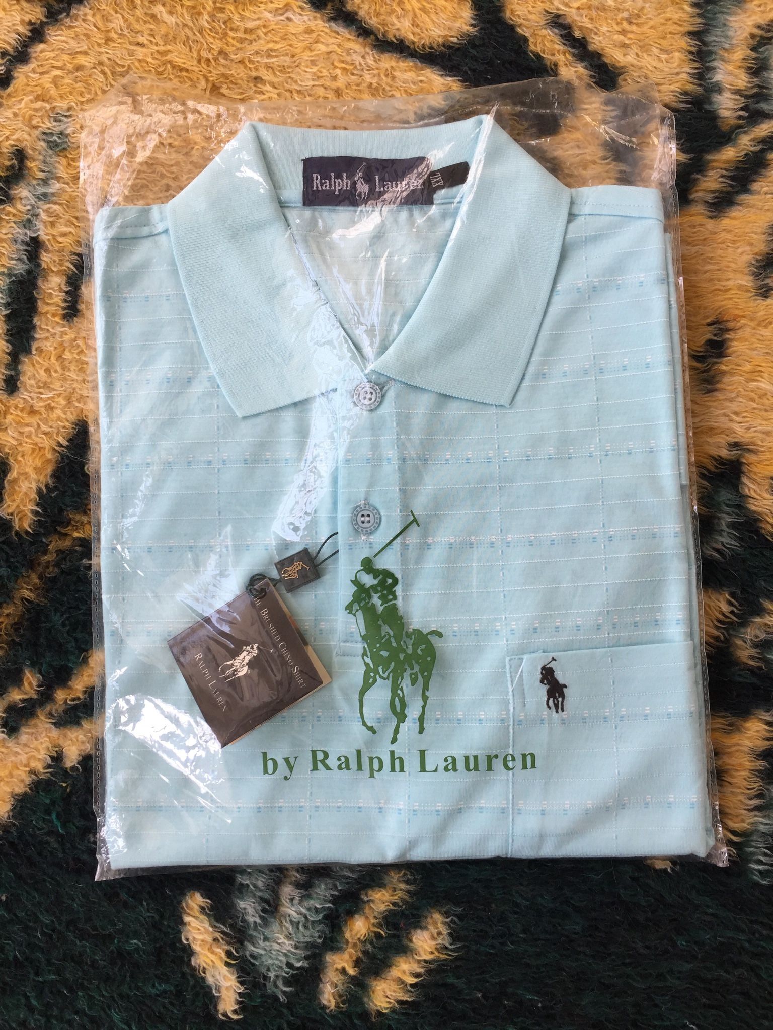Great Father’s Day Gift! POLO T-shirt. Brand new. Never used. Still sealed in original packaging. Beautiful soft color. Great bargain.
