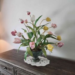 Beautiful imitation flowers with imitation brass vase/pot. Pretty lightweight.