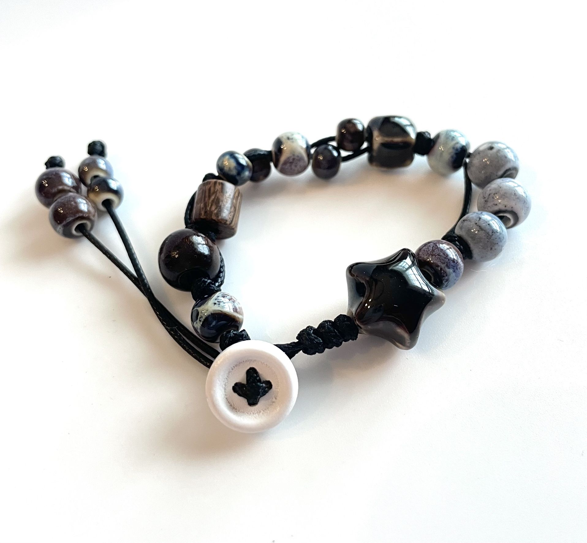 Black Star Bracelet white button cord blue swirl ceramic beads adjustable
