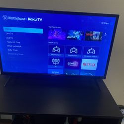 32 inch roku tv w/remote + Tv Stand 