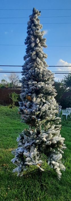 Artificial Christmas tree with lights and snow