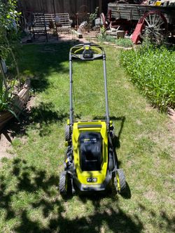 40v 20” self propelled ryobi push mower + 2 batteries and changer