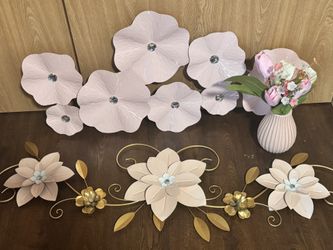 two pink decorations along with a vase