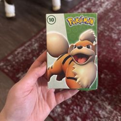 Pokémon Happy Meal toy box from McDonald's, featuring the Pokémon Growlithe