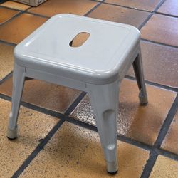 Lt  gray metal footstool