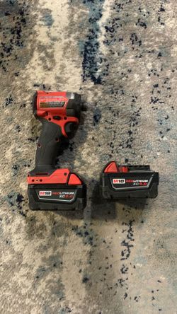 Milwaukee 1/4 impact with  batteries