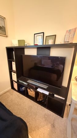 Black IKEA TV stand and shelving unit