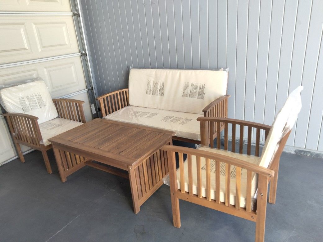 Outdoor patio wood loveseat with chairs and coffee table