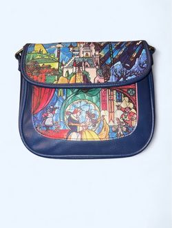 The Loungefly Disney Beauty and the Beast Small Blue Simulated Leather Crossbody is a stylish handbag featuring elements from the beloved Disney franc
