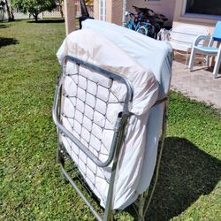 Folding Metal Frame Bed With Mattress And Wheels. Good Condition 