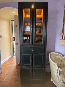 Black distressed entertainment center.