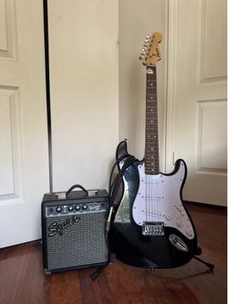 Squier Electric Guitar and Squier Amp + pick