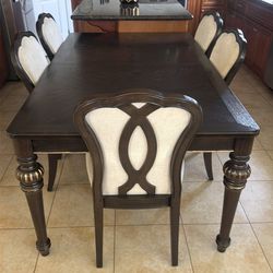 Espresso dining table with six chairs