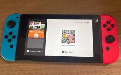 Nintendo switch with red and blue controllers