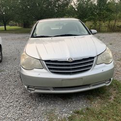 2007 Chrysler Sebring runs and drives great it needs. O2 sensor needs to be cleaned, needs new coil packs,needs a new passenger side door panel, and t