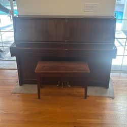 Hohner HP110 upright piano with a matching bench