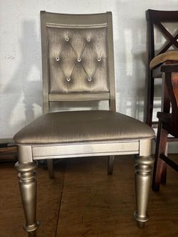 Modern contemporary metallic silver stud chair. 17 “high to seat , 20” wide, 41 “ high to top . $50 JUST ONE CHAIR