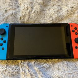  Nintendo Switch 32GB Handheld Console - Neon Red/Neon Blue Very Good Condition.