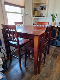 Bar height table and chairs