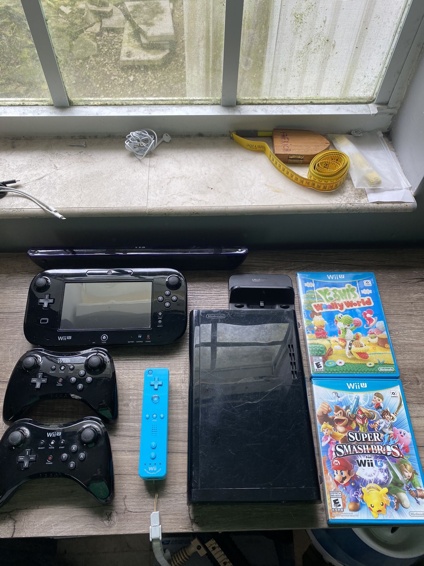 Black Nintendo Wii U with games